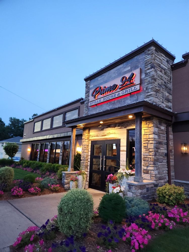 Busy restaurant exterior with prominent signage and outdoor dining area